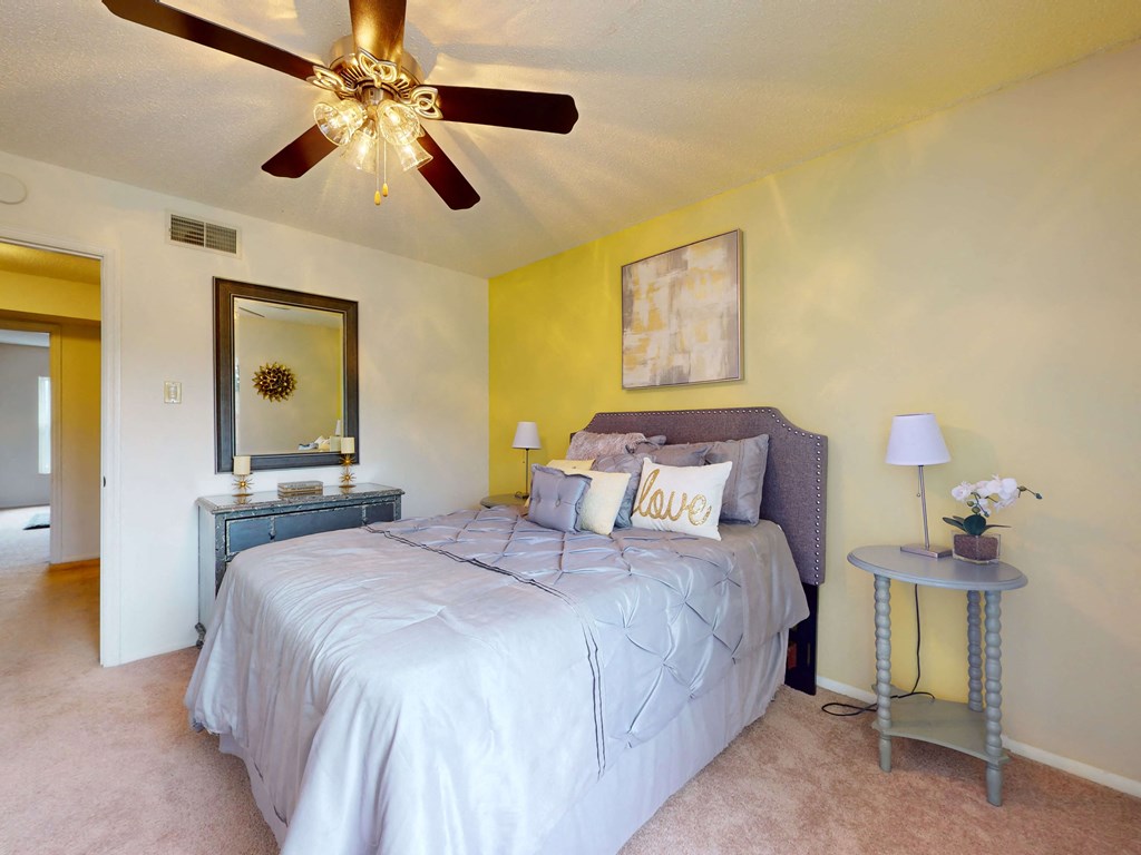 apartment bedroom with a ceiling fan