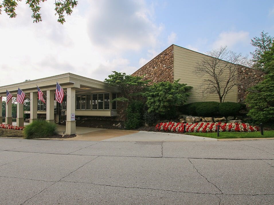 leasing office with flowers in front of it