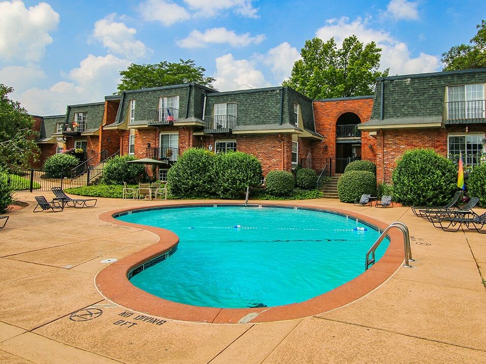 a large swimming pool at apartment complex