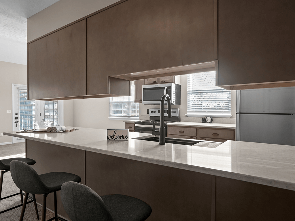 a kitchen with a large counter top and a sink