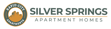 The image is a logo for Silver Springs Apartments.