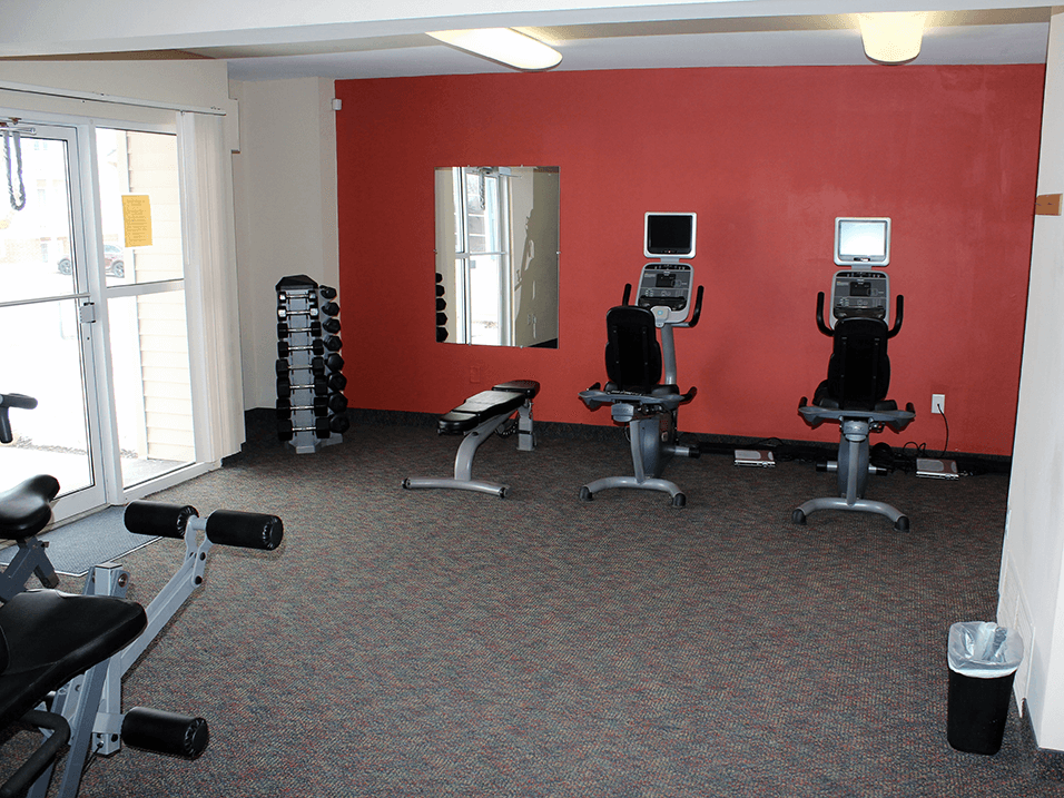 private fitness center at Sun Valley apartments with gym equipment.
