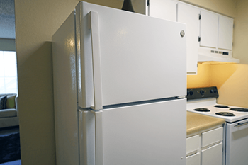 A white refrigerator in a kitchen.