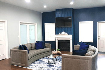 a living room with two couches and a fireplace