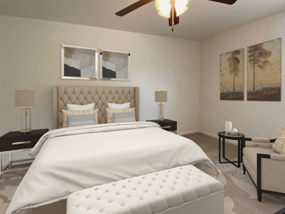 Bedroom with overhead light and fan at brickyard apartments