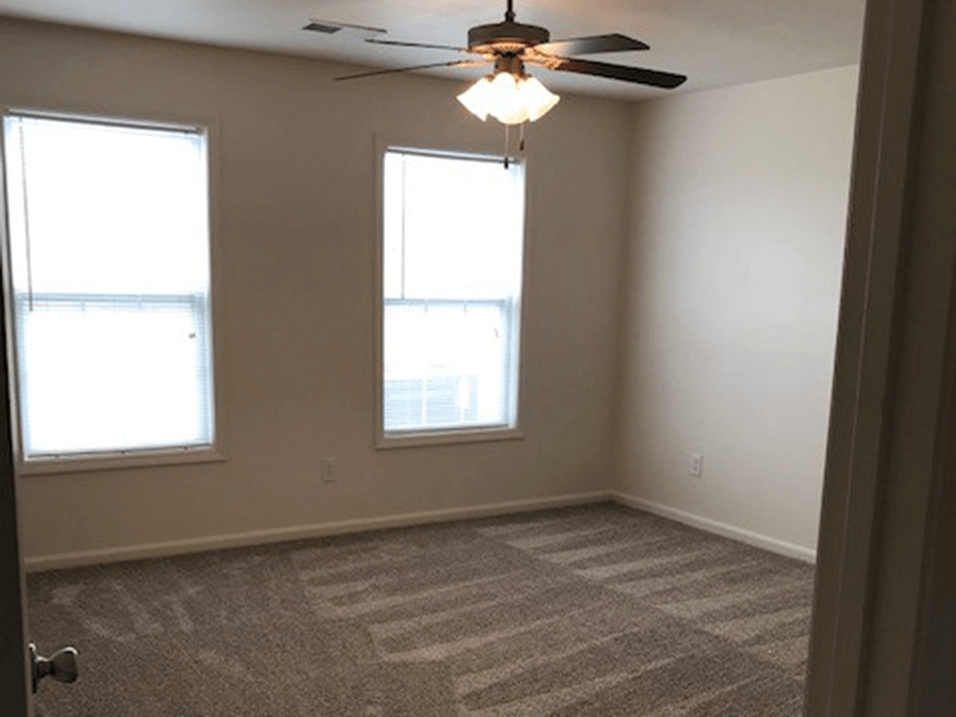 Large bedroom with lots of lighting at the brickyard apartments