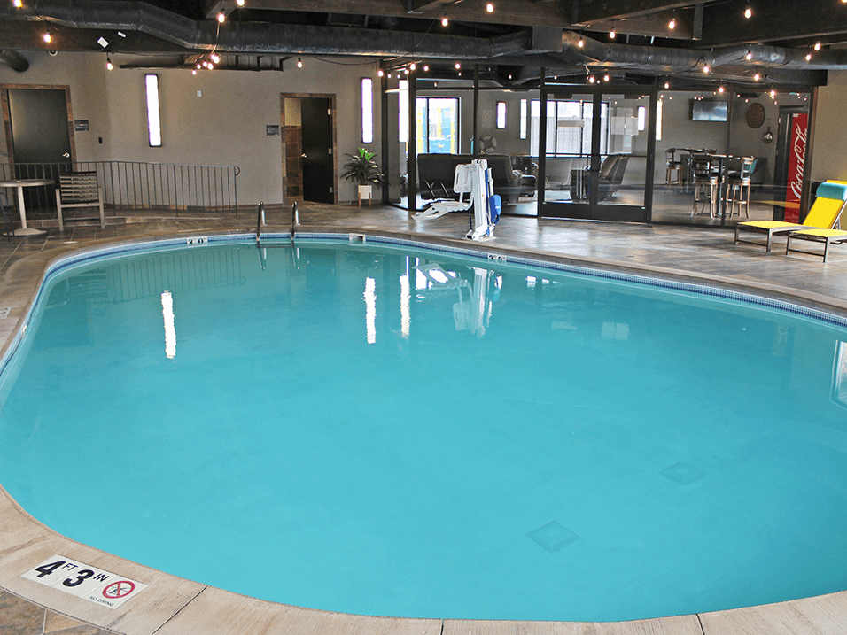 a large indoor swimming pool at apartment complex
