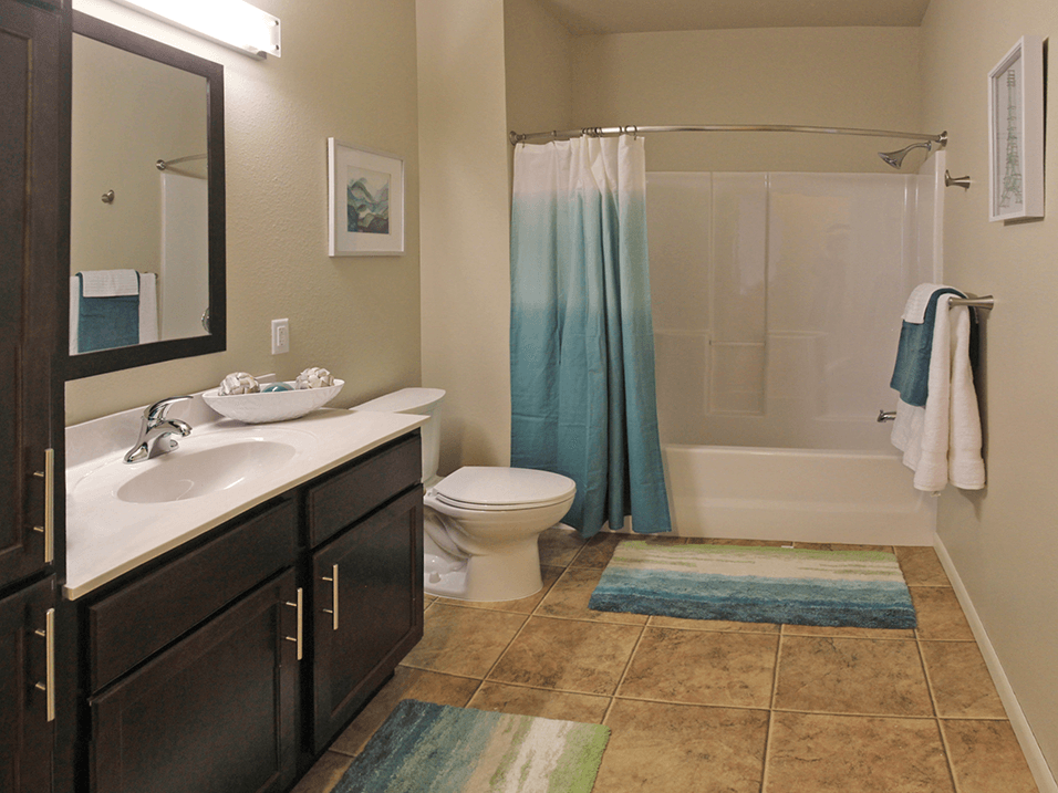 a bathroom with a toilet sink and bathtub