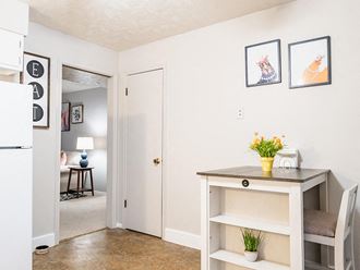 spacious kitchen area with a white refrigerator - Photo Gallery