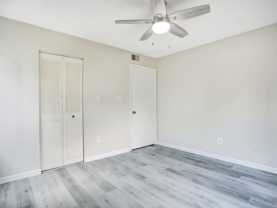 Bedroom with overhead fan and wood style flooring