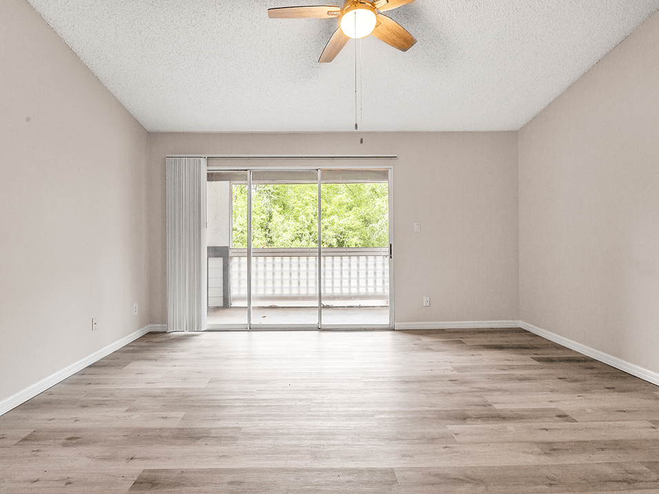 Living area that opens out to a screened patio