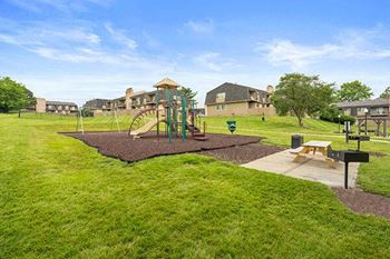 a park with a playground and a picnic table