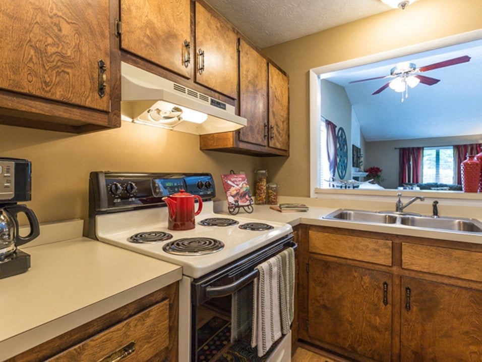 kitchen with cabinets and oven at tartan place