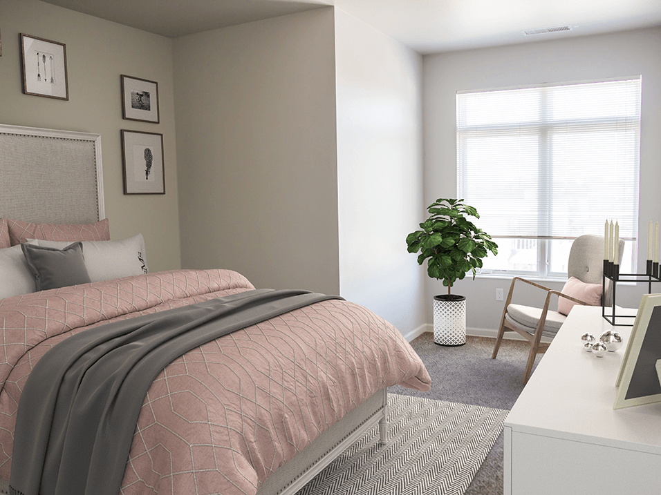 a bedroom with grey walls and a pink bedspread