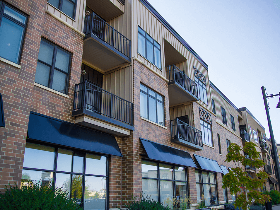 a brick apartment building with awnings