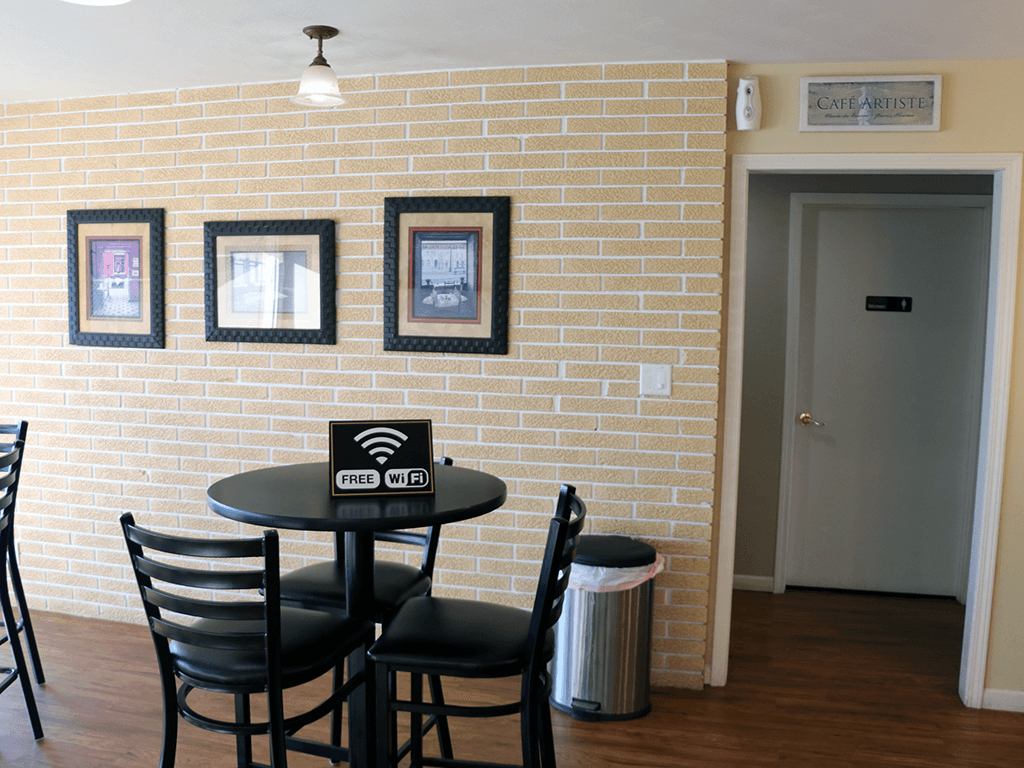 A cafe with a sign that says