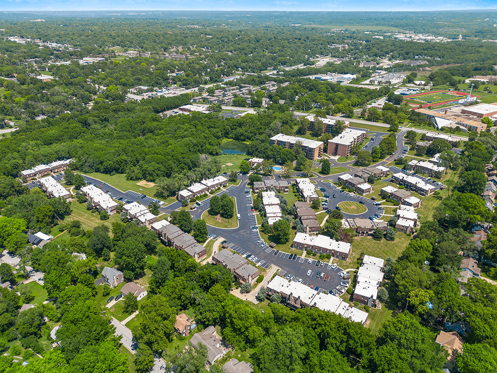 an aerial view of a city with buildings and trees