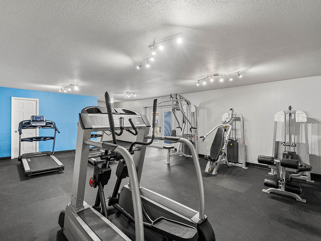 a gym with weights and cardio equipment at the enclave at woodbury