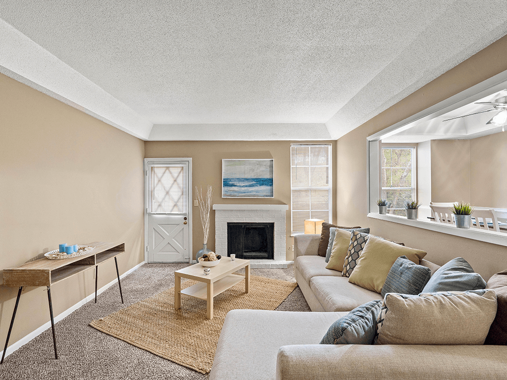 a living room with a couch and a fireplace