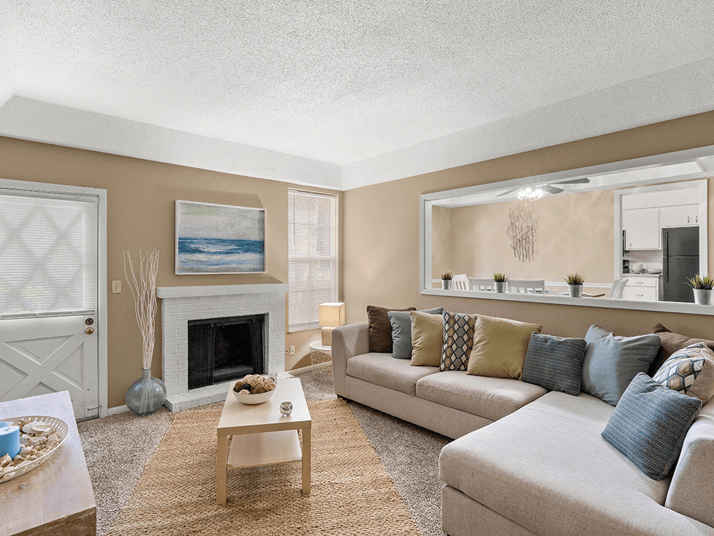a living room with a couch and a fireplace