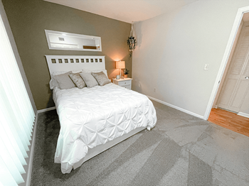 bedroom with natural light at tiffany woods apartments - Photo Gallery 6