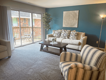 spacious living area with attached balcony - Photo Gallery 3