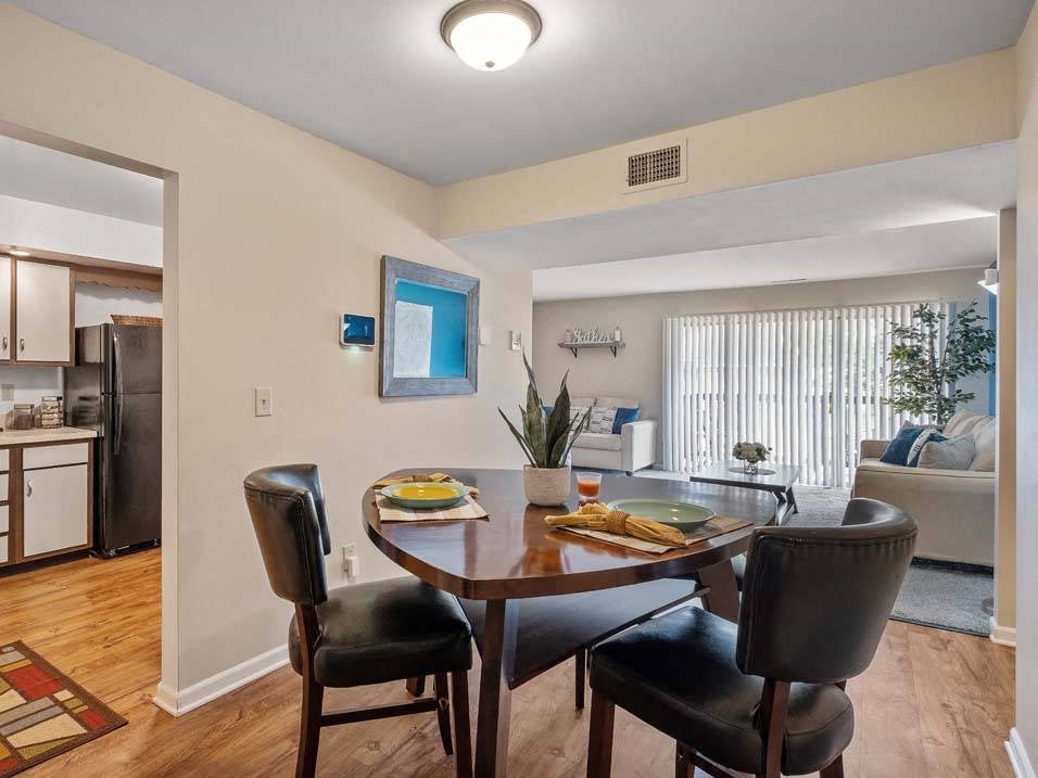 a dining room with a table and chairs