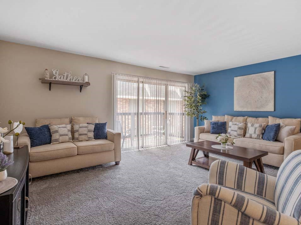 a living room with a couch and a chair