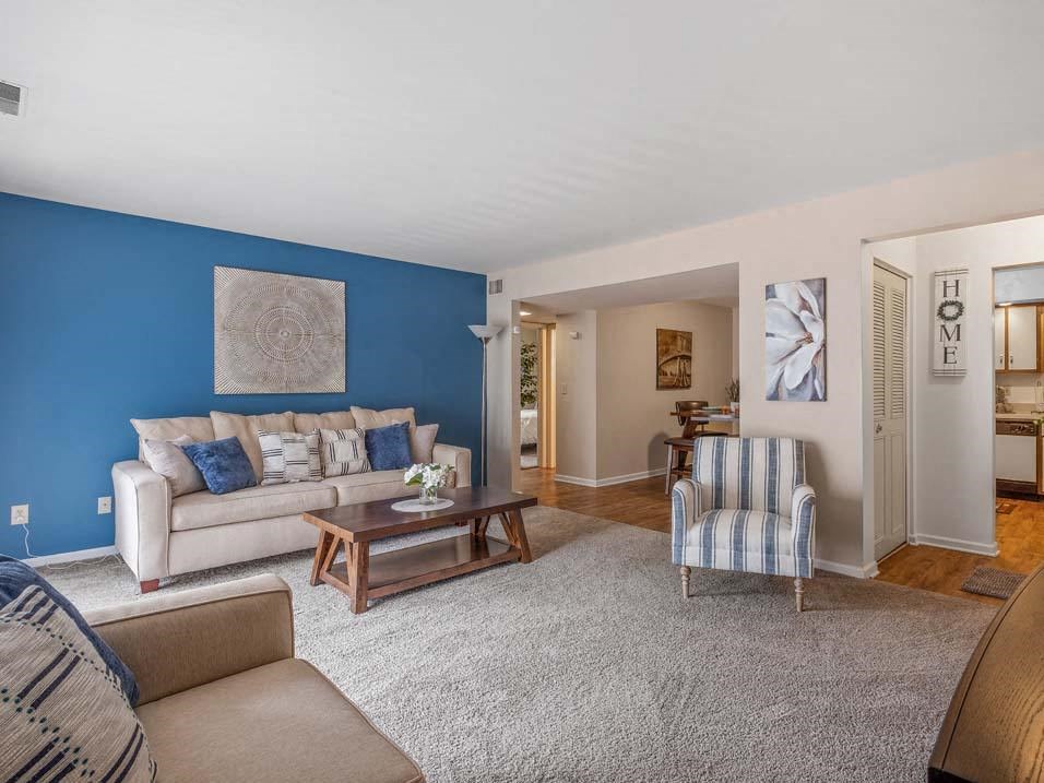 a living room with a couch and a chair