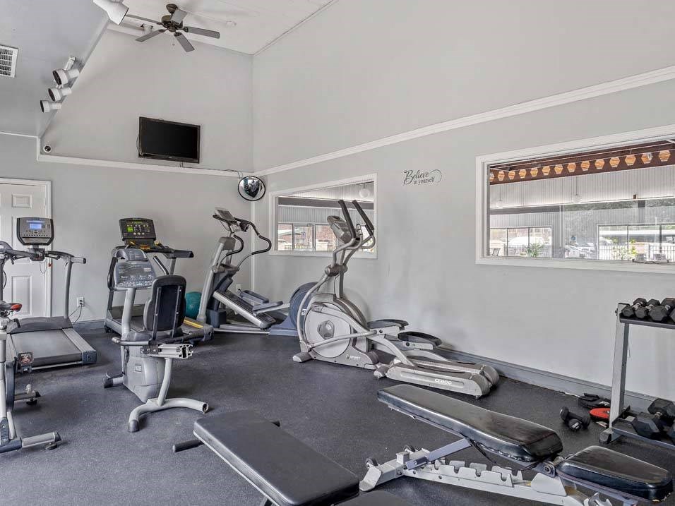 a home gym with treadmills and exercise bikes