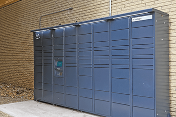 A blue amazon hub for residents at vantage point for packages.