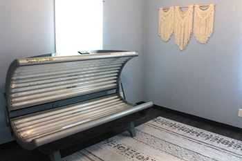 a tanning bed at village quarter apartments