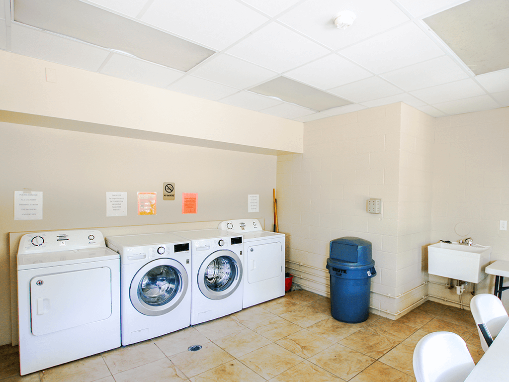 a laundry room with washing machines