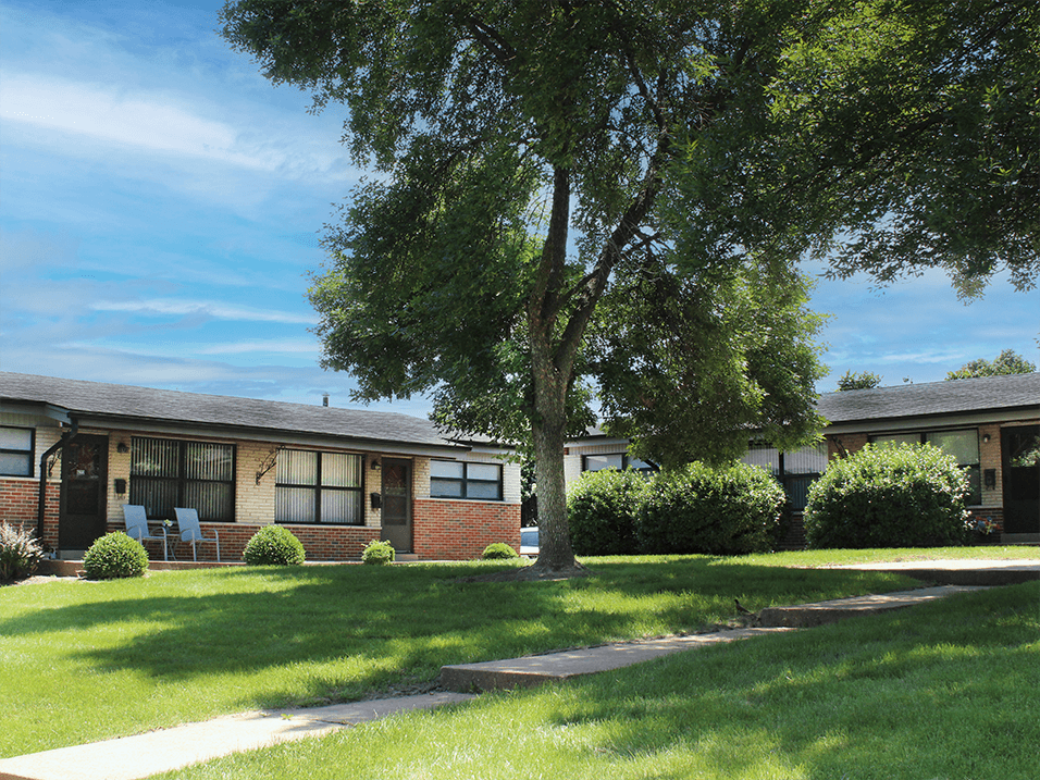 apartment complex with landscaping