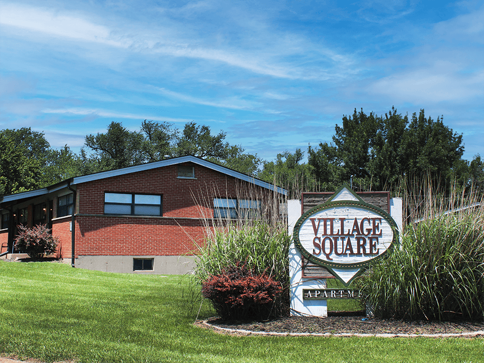 sign for Village Square Apartments