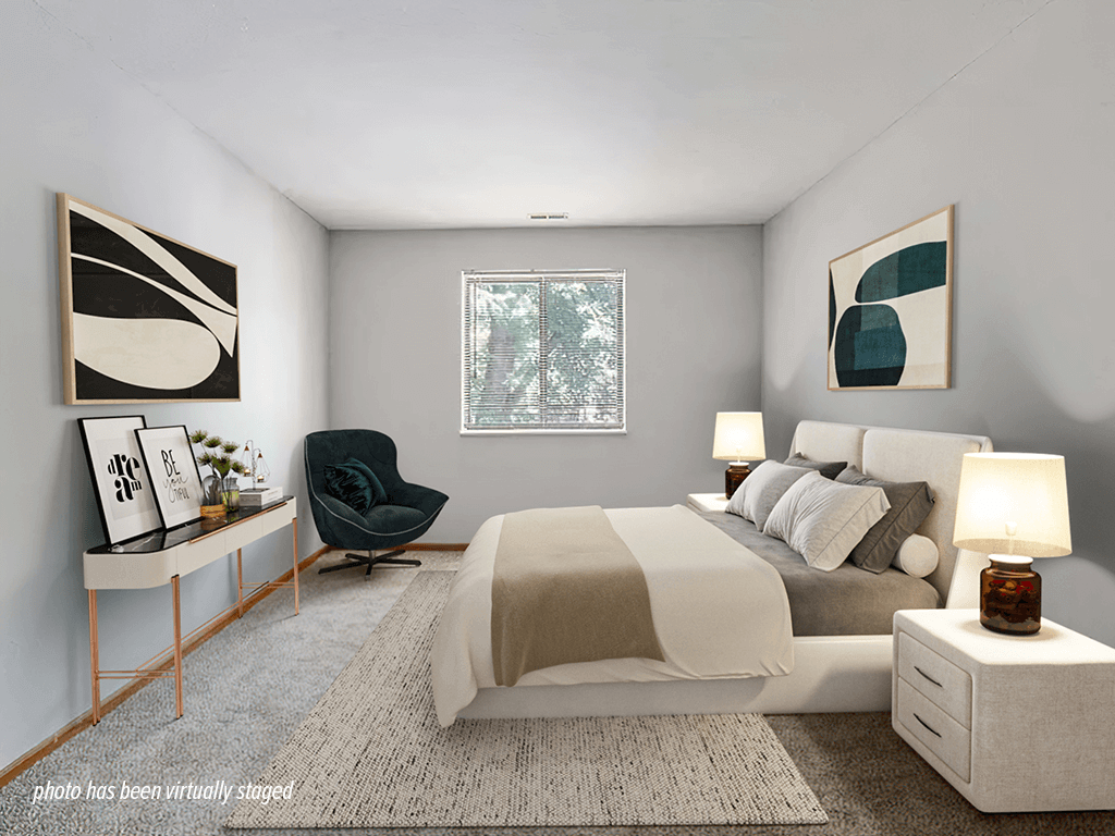 A modern bedroom with a large bed, a chair, and window