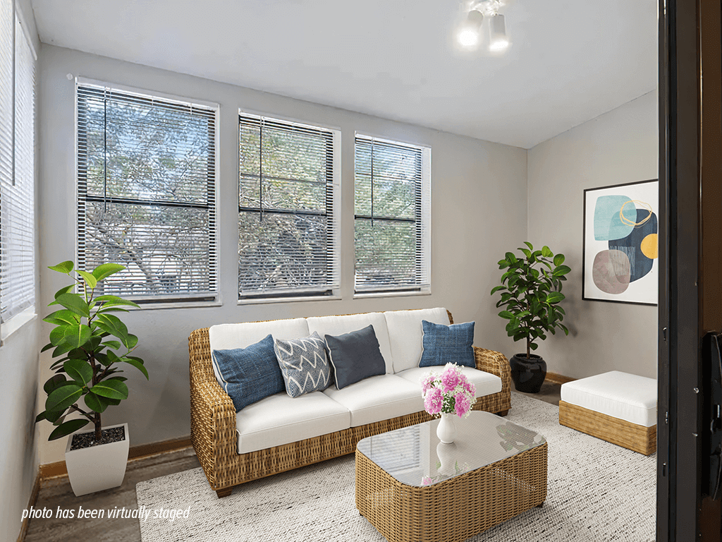 A living room with a three windows