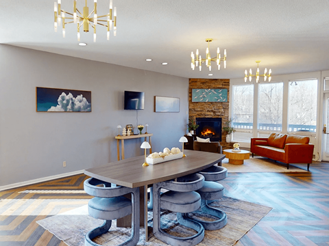 A modern dining room with a large table and chairs.