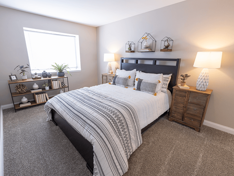a bedroom with a bed and a window