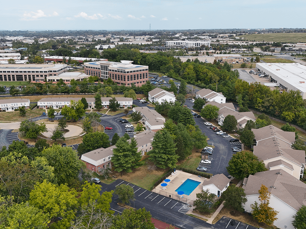 aerial view of apartments with shade trees