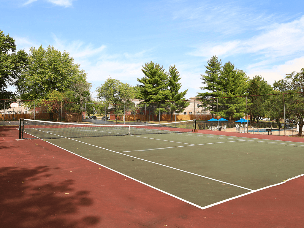 private tennis court at apartment community