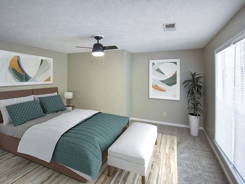 a bedroom with a bed and a ceiling fan