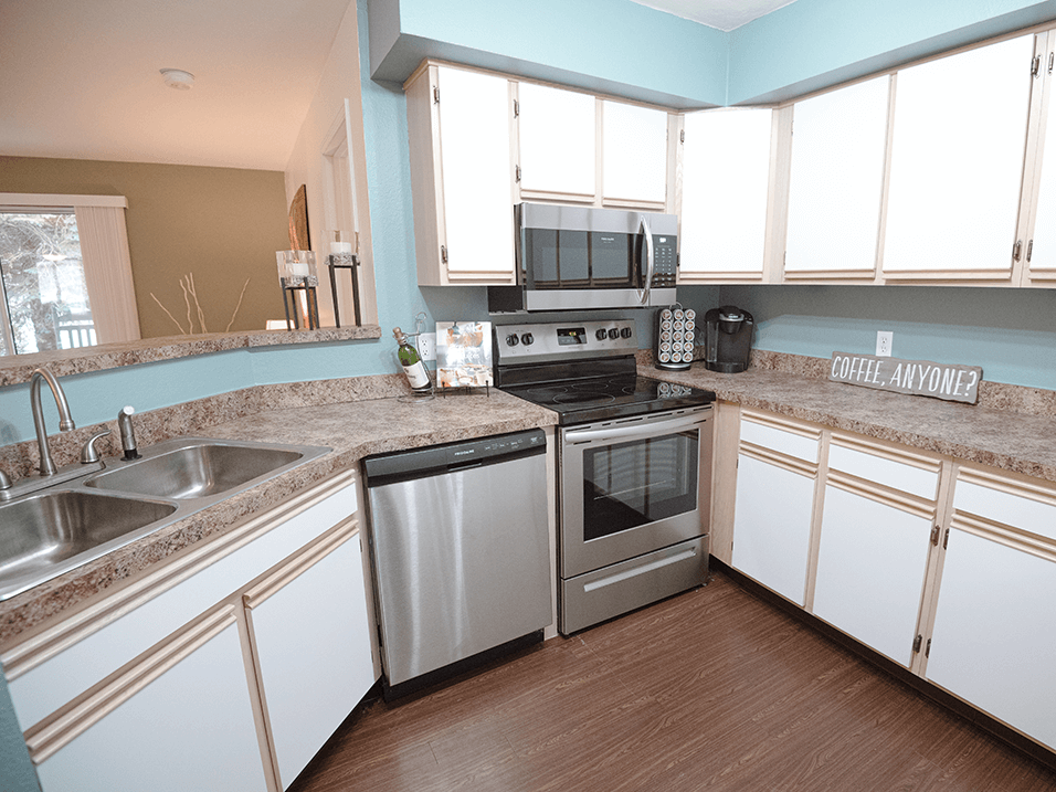 apartment kitchen with dishwasher, oven, and microwave in spring lake