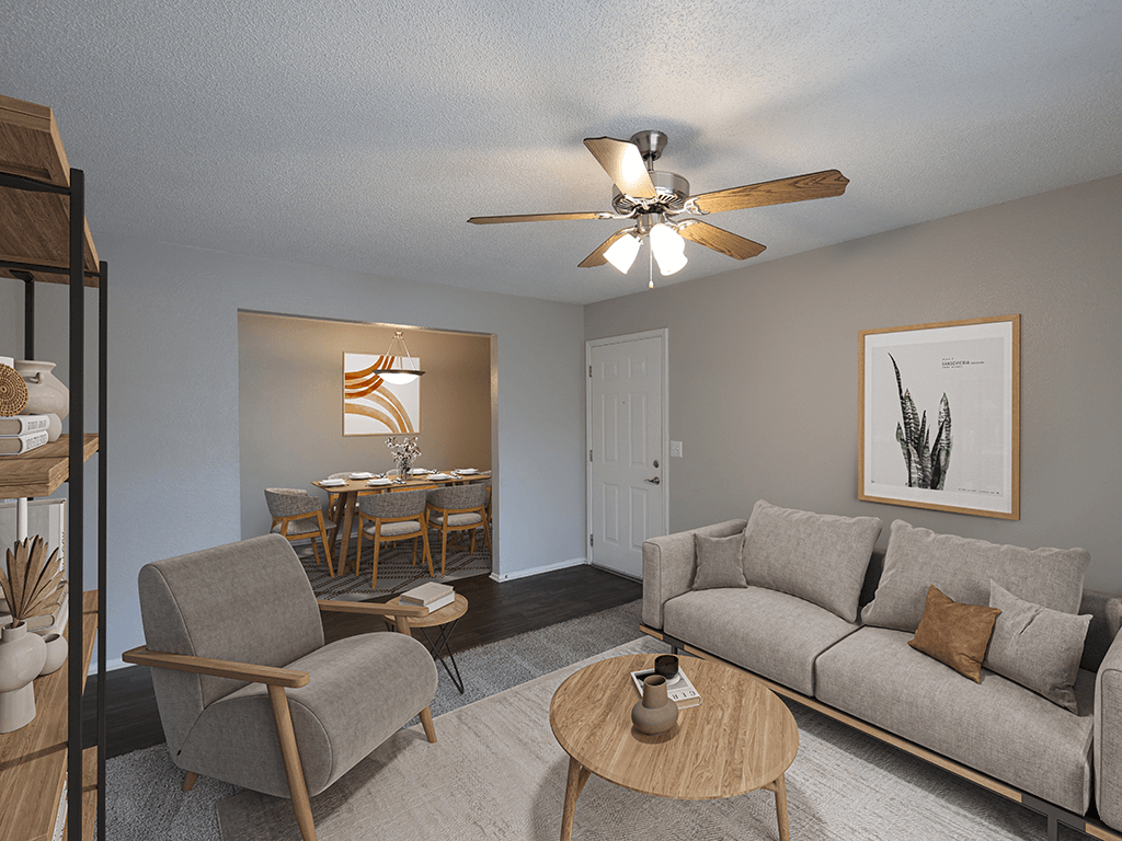 an open living room and dining room with a ceiling fan
