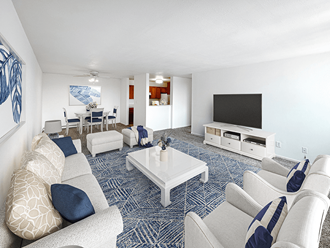a living room with blue carpet and white furniture