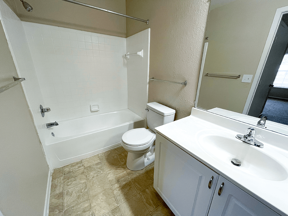 a bathroom with a toilet sink and bathtub