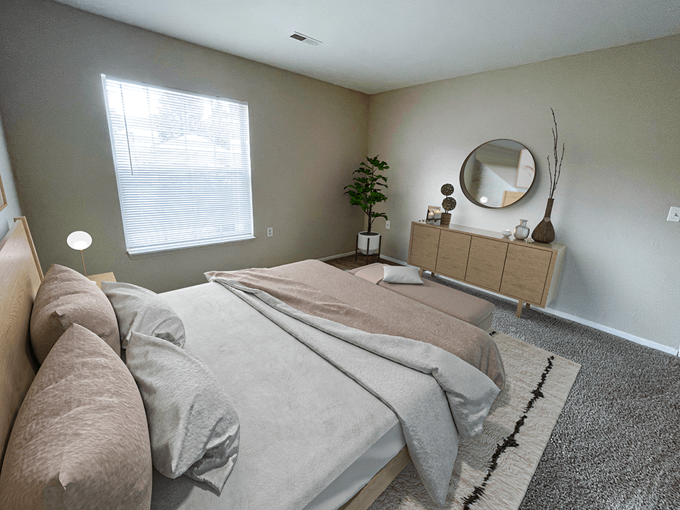 a bedroom with gray walls and a large window