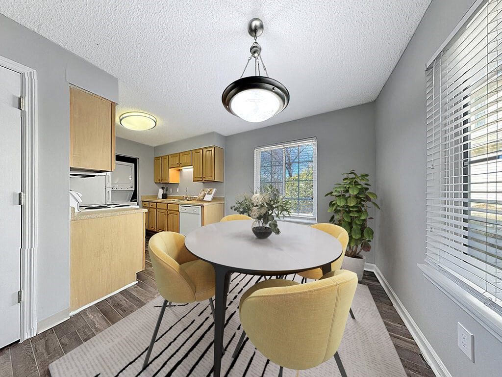 a dining room with a table and chairs