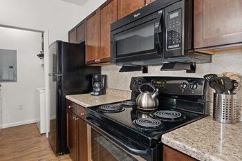 a kitchen with a stove and a microwave