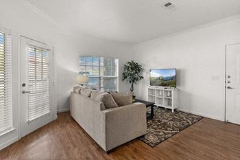 a living room with a couch and a tv